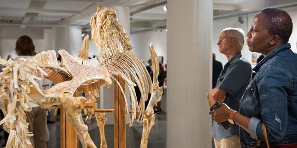 Visitors to Wits Art Musuem consider this literary horse book art at the launch of the Jack Ginsberg Centre for Book Art housed at WAM.